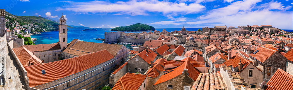 Obraz premium Dubrovnik 14k panorama of Old Town orange roofs and churches from medieval city walls in Croatia. Scenic aerial view of Adriatic sea and historic stone architecture. UNESCO heritage travel scenery