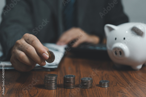 hand stacking coins on table ,Business Finance and Money concept,Save money for prepare in the future.