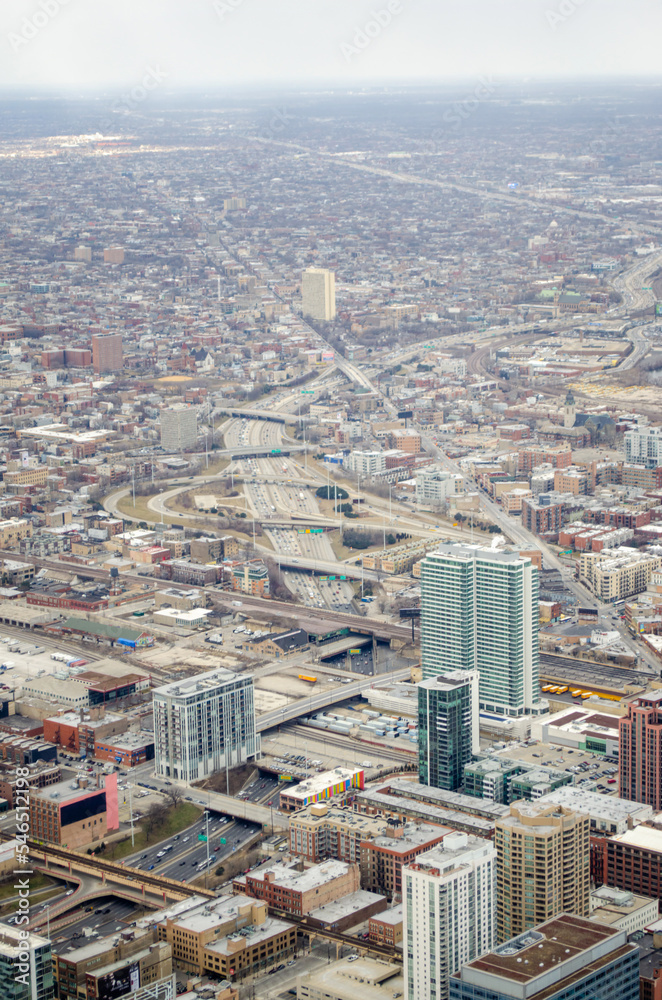 Fototapeta premium Highway ramps and intersections in city of Chicago aerial view from tallest building in North America