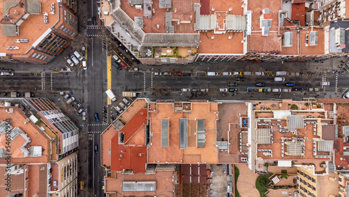 perpendicular view of the rooftops and street of the eixample district in barcelona photo