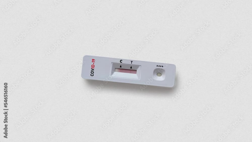 Quick test unit to check for coronavirus with positive result showing two lines isolated on white background close upper view Quick test unit to check for coronavirus with positive result showing two lines isolated on white background close upper view