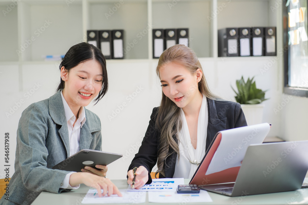 Portrait of Asian young female working on laptop at office Portrait of Asian young female working on laptop at office
