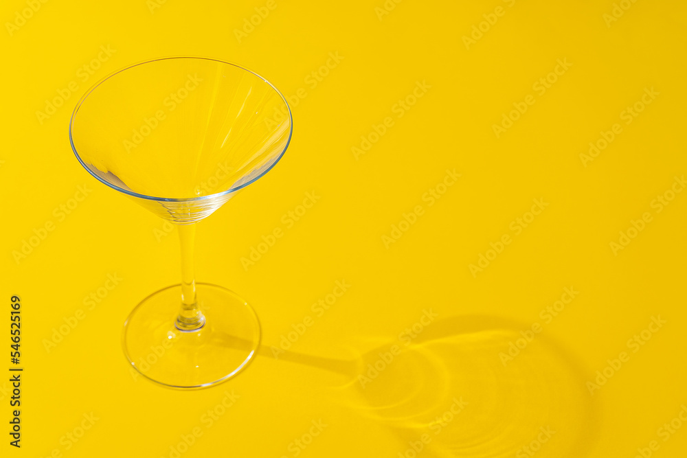 Empty transparent glass on a color background with copyspace.