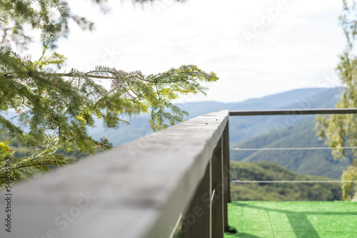 Amazing patio, wooden deck with outdoor furniture and mountain view