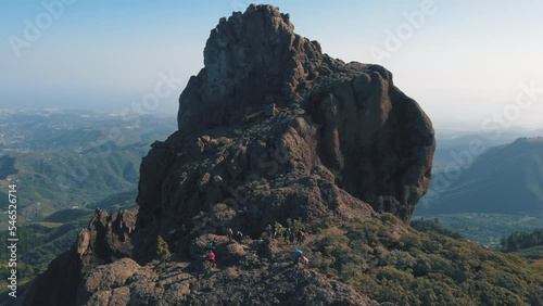 fantastic aerial shot in orbit and a short distance from the famous Roque Saucillo and where a group of tourists is. On the island of Gran Canaria on a sunny day. photo