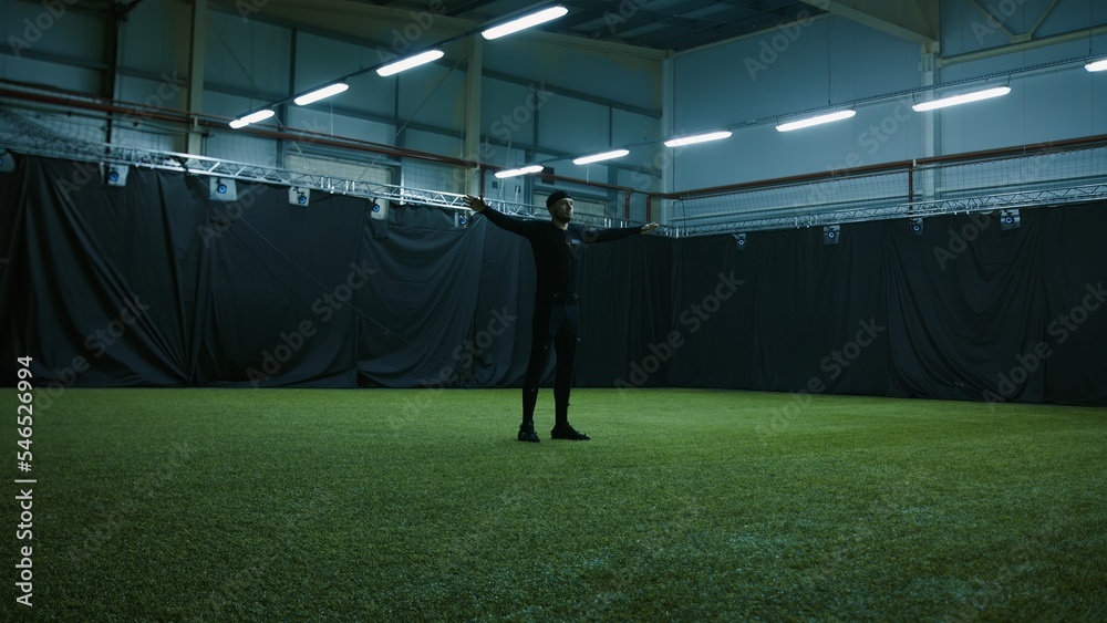 BTS of filmmaking. Actor is standing in Tpose for calibrating motion