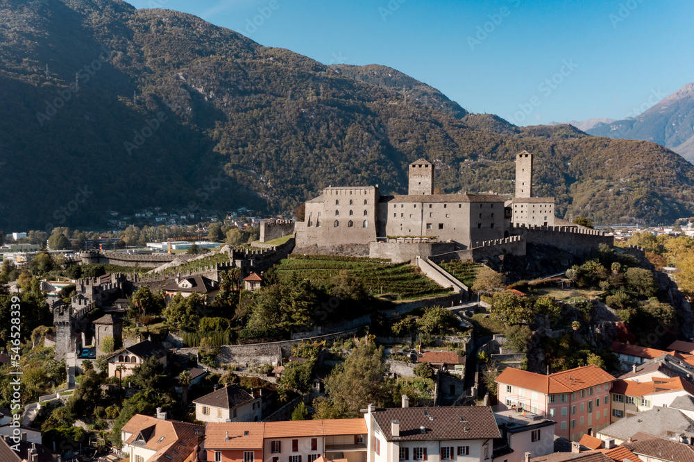 Aerial view of Bellinzona Castle atop the Swiss Alps taken from a drone on a sunny day. Fantastic view