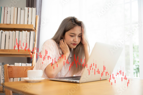Принти на полотні Stressed youn woman shocked by bankruptcy stock downfall financial crisis, line graphs bar chart and candlesticks go down