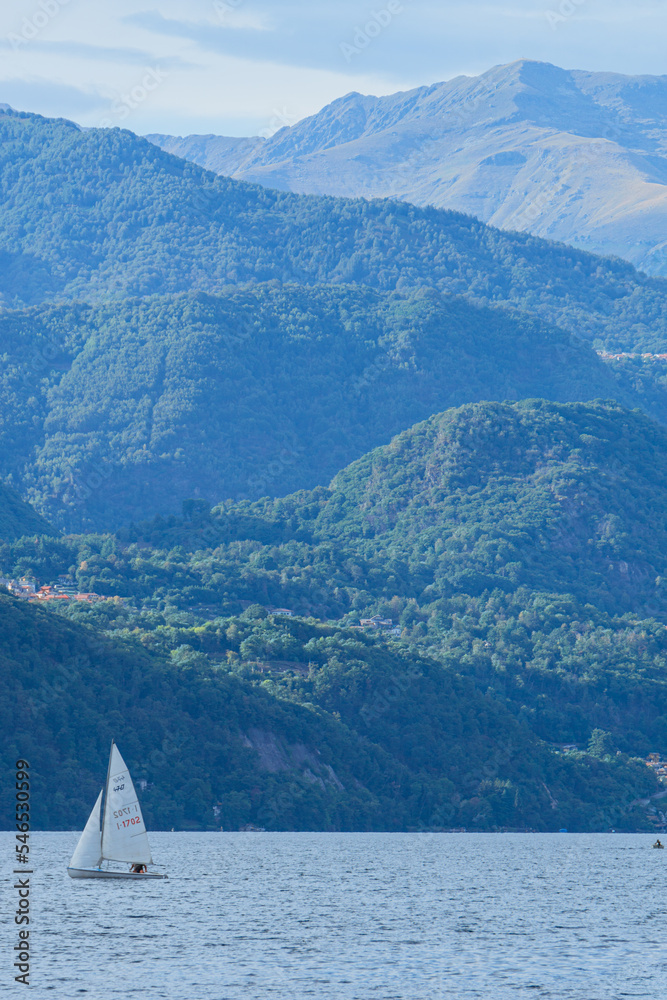Naklejka premium Lake orta and the island of san giulio, an important tourist destination in piedmont, seen during a summer day from the town of Orta San Giulio, Italy - August 2022.
