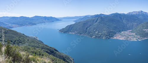 Extra wide angle Aerial view of the Lake Maggiore with blue sky from a mountain