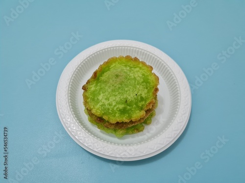 A market snack made from flour and other ingredients is called kue kucur green photo