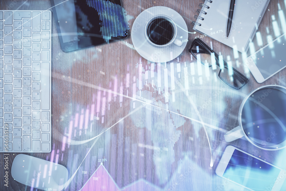 Double exposure of financial chart hologram over desktop with phone. Top view. Mobile trade platform concept. Double exposure of financial chart hologram over desktop with phone. Top view. Mobile trade platform concept.