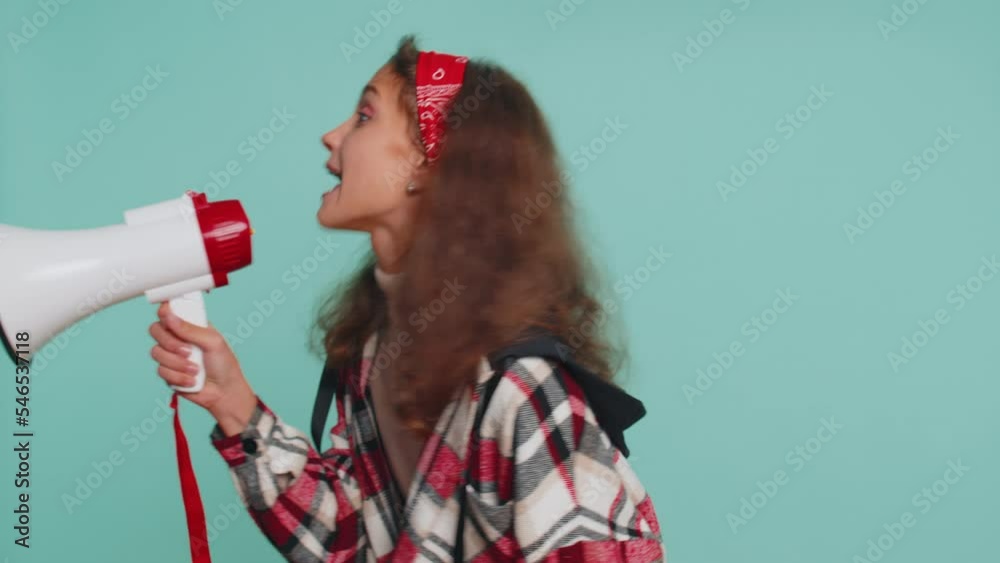 Hurry up. Young teenager child girl kid talking with megaphone ...