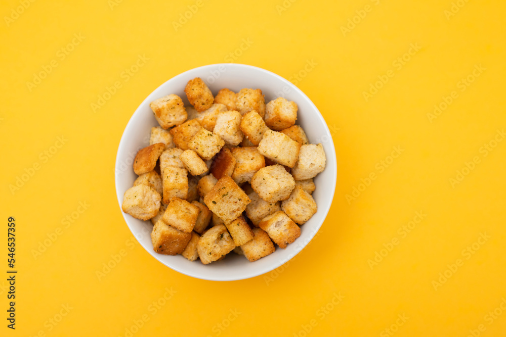 Crispy dry cubes of white bread in bowl Crispy dry cubes of white bread in bowl