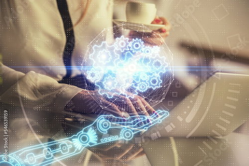 Multi exposure of woman hands working on computer and data theme hologram drawing. Tech concept.