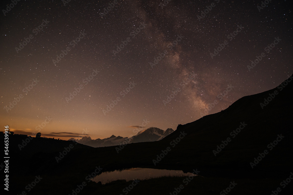 starry night over a mountain lake near Elbrus, milky way starry night over a mountain lake near Elbrus, milky way
