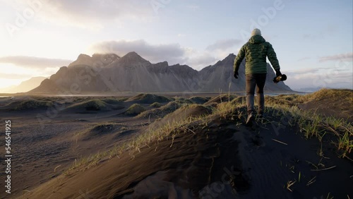 Man Walking To Photograph Mountain Range