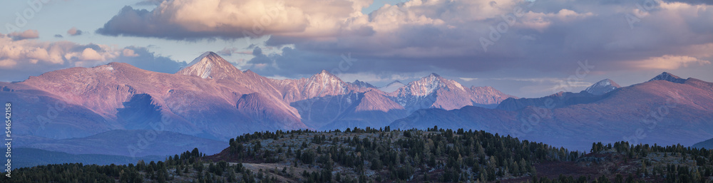 Sunset light in the mountains, panoramic view