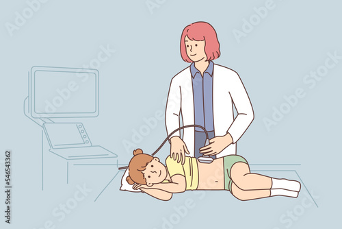 Female doctor do ultrasound of girl in clinic 