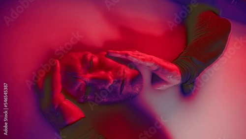 Psychedelic dream of a man with a split personality in a bad trip. The concept of psychedelia, nirvana and addiction