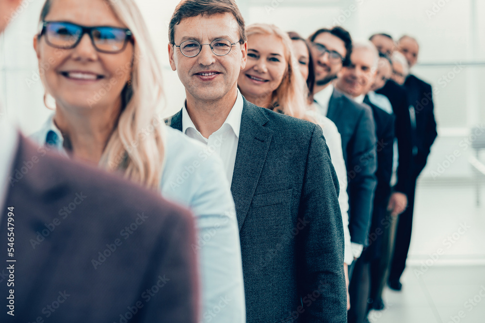 close up. group of happy employees standing in the office.