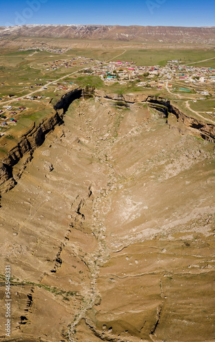 Tobot Waterfall in the Republic of Dagestan, Russia. A high falling column of water. Panorama from a drone. Travels in Russia. Tourism in Dagestan. Popular destinations. The beauty of nature. Sights. photo