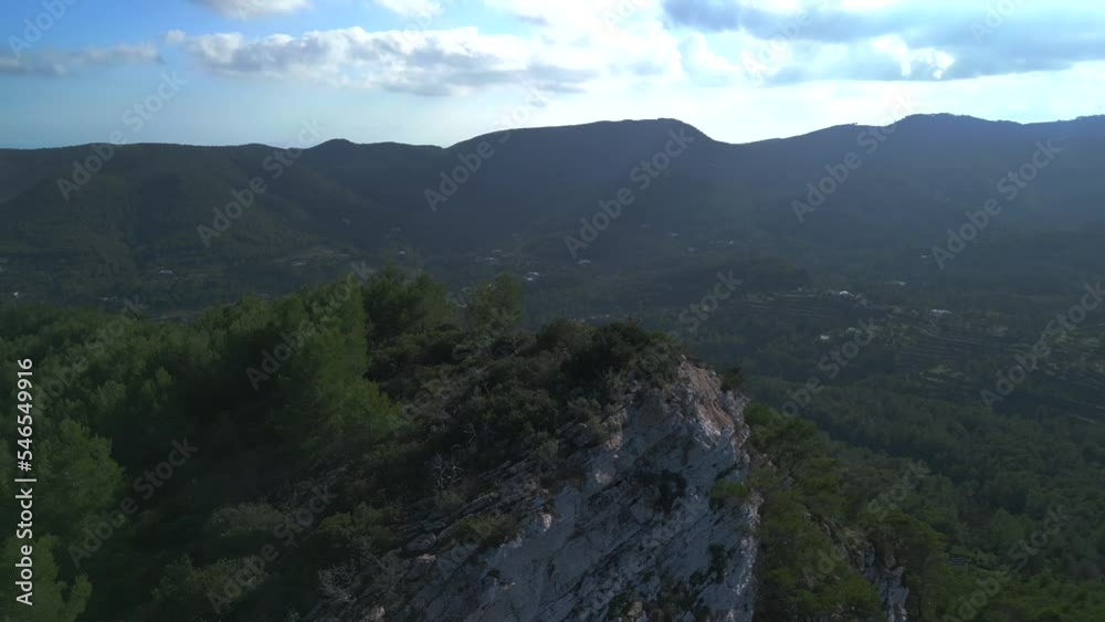Hikers take a break on top of the mountain. Beautiful aerial view flight ibiza Hikers take a break on top of the mountain. Beautiful aerial view flight ibiza