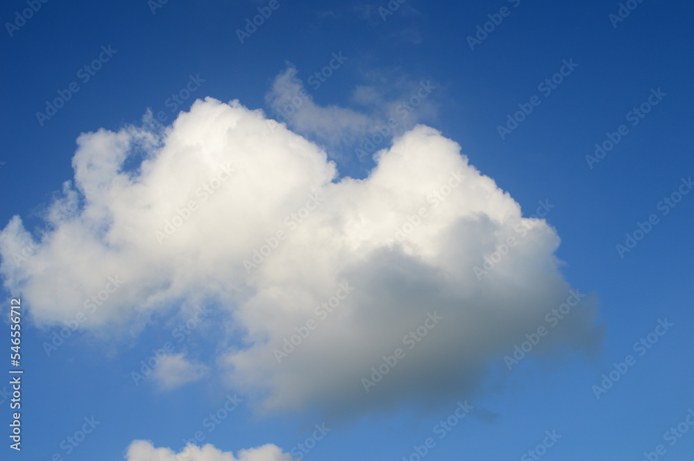 white fluffy clouds in the blue sky white fluffy clouds in the blue sky