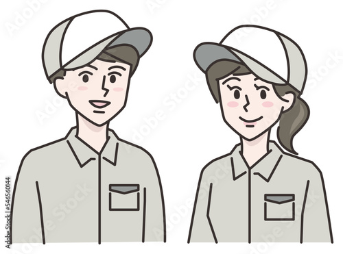 笑顔の作業服を着た若い男女