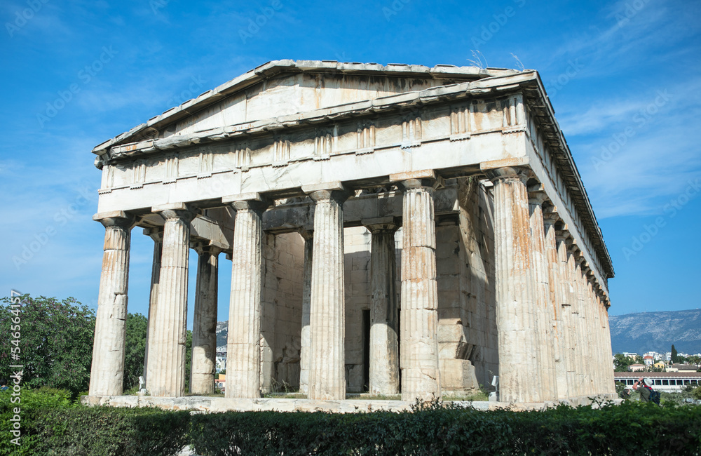 Temple of Hephaestus in Athens, Greece. Sunny view of Ancient Greek ruins in the Athens center. The Famous Hephaistos temple on the Agora in Athens, the capital of Greece.