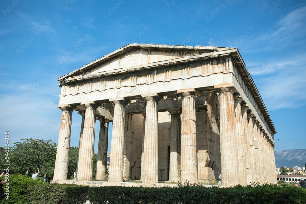 Temple of Hephaestus in Athens, Greece. Sunny view of Ancient Greek ruins in the Athens center. The Famous Hephaistos temple on the Agora in Athens, the capital of Greece.