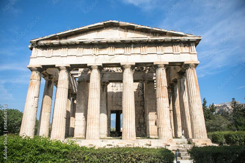 Temple of Hephaestus in Athens, Greece. Sunny view of Ancient Greek ruins in the Athens center. The Famous Hephaistos temple on the Agora in Athens, the capital of Greece.