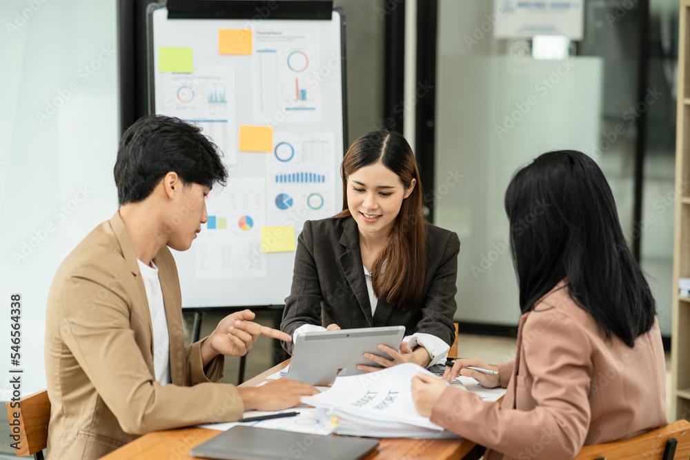Asia business meeting consultations of business people in the company's meeting room. Asia business meeting consultations of business people in the company's meeting room.