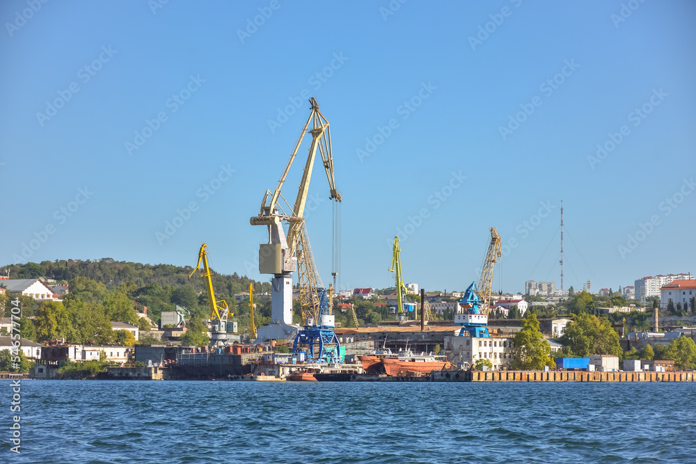 Sevastopol, Crimea, Russia - September 15, 2020: Ships and cruise liner in the docks of Sevastopol port, Black sea. Vessels in the port of Sevastopol