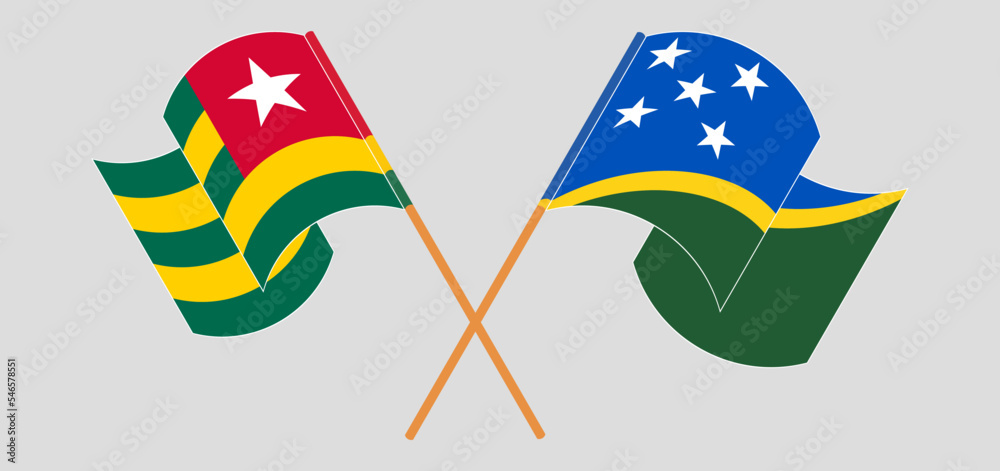 Crossed and waving flags of Togo and Solomon Islands Crossed and waving flags of Togo and Solomon Islands