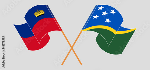 Crossed and waving flags of Liechtenstein and Solomon Islands