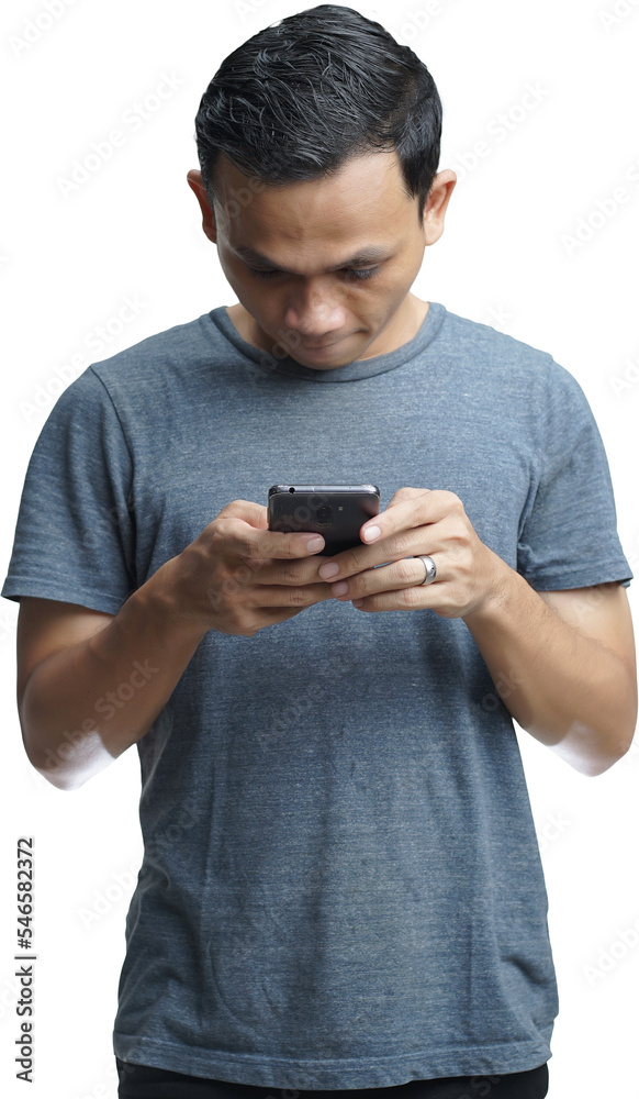 Young smiling handsome Asian man in casual attire using mobile phone isolated studio background Young smiling handsome Asian man in casual attire using mobile phone isolated studio background