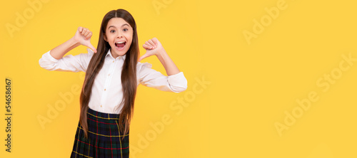 happy teen girl in school uniform full length pointing fingers on herself, happiness. Child face, horizontal poster, teenager girl isolated portrait, banner with copy space.