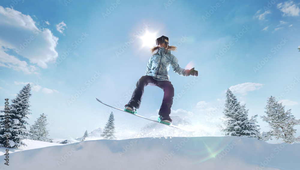 Snowboarder girl in action. Extreme winter sports.