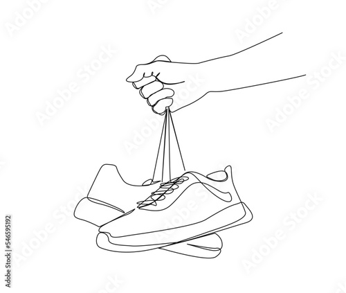Continuous one line drawing of hand holding sneakers. Fashionable and casual sneakers line art drawing vector design. shoes lineart design.