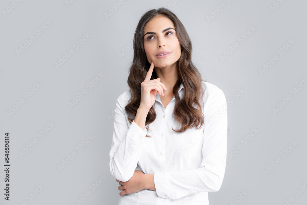 Portrait of young woman thinking, looking up empty space. Thoughtful serious model in studio looking away. Girl thought choose decide solve problems. Portrait of young woman thinking, looking up empty space. Thoughtful serious model in studio looking away. Girl thought choose decide solve problems.