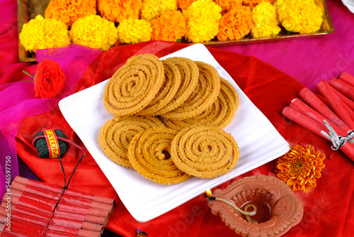 Indian Traditional Snack Chakli, a spiral shaped, Chakali or murukku Indian Traditional Tea Time Snack, Traditional Diwali festival snacks in India. photo