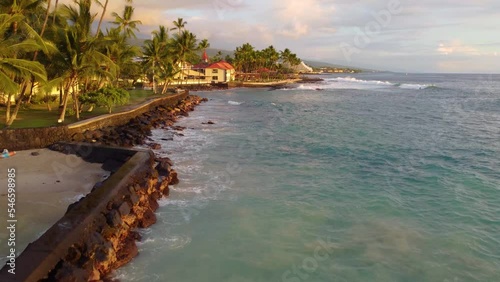 Drone view of buildings on the shore surrounded by the sea in Kailua-Kona, Hawaii photo