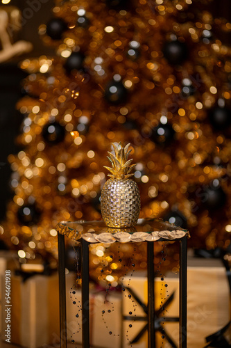 Merry Christmas and Happy Holidays!Beautiful black modern living room decorated for Christmas.Chrystmas Luxury black style living room interior with sofa decorated chic , golden style.Selective focus.