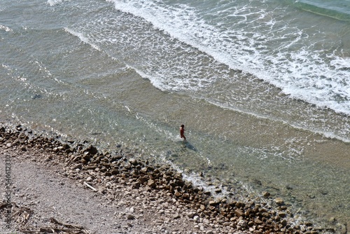 Gaeta - Turista solitaria sulla riva della Spiaggia di Sant'Agostino photo