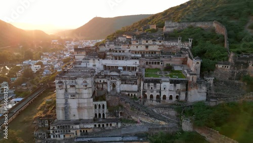 Aerial view of Garh Palace situated in Bundi town, Rajasthan state in India shot during sunset time. photo