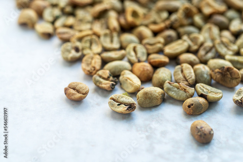Fotografie a pile of green bean coffee defect on marble background