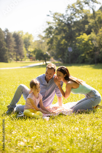 Happy young family with cut...