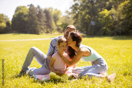 Happy young family with cut...