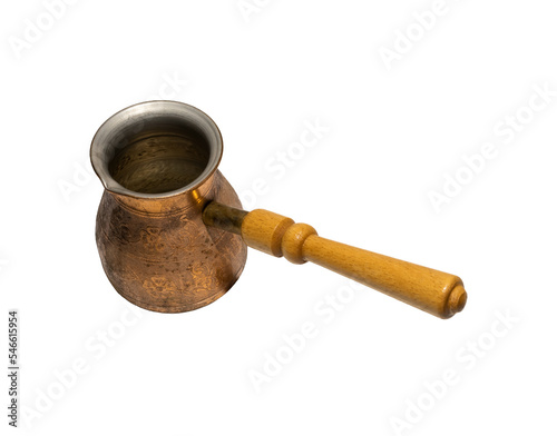 Empty brass cezve isolated on white background. copper turka with wooden handle. Ready for cut out photo